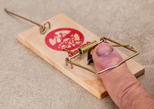 Mans finger caught in Rat trap