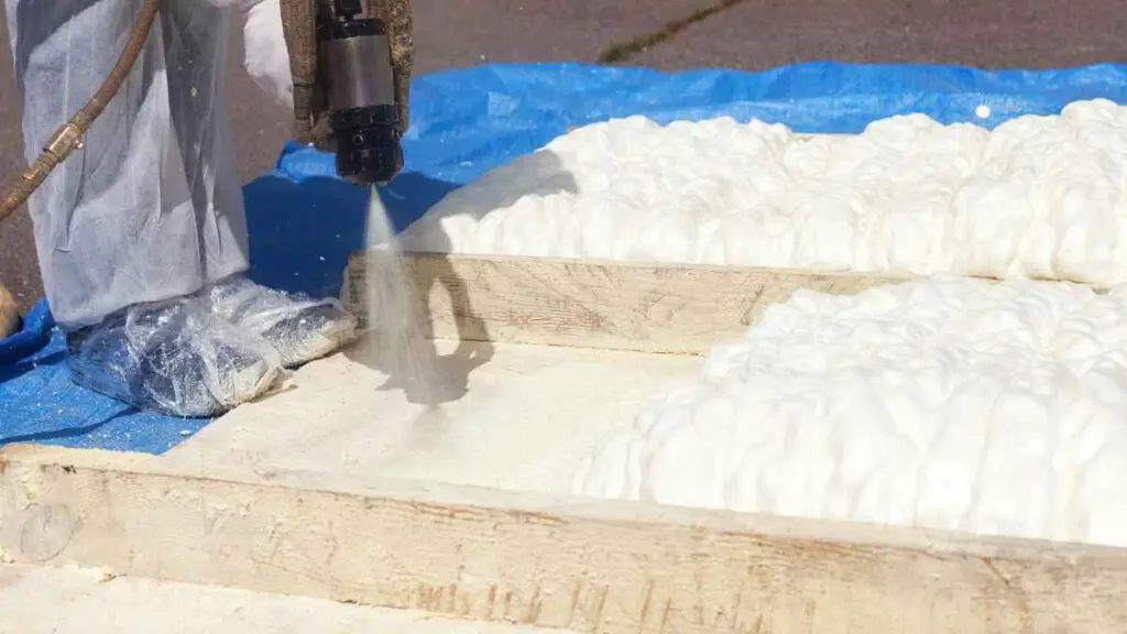 man spraying foam